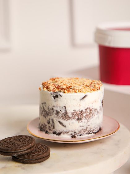 A close-up of our Mint Oreo ice cream cake, revealing chunks of cookies swirled into creamy mint ice cream. It’s a cool, classic combination that never disappoints.