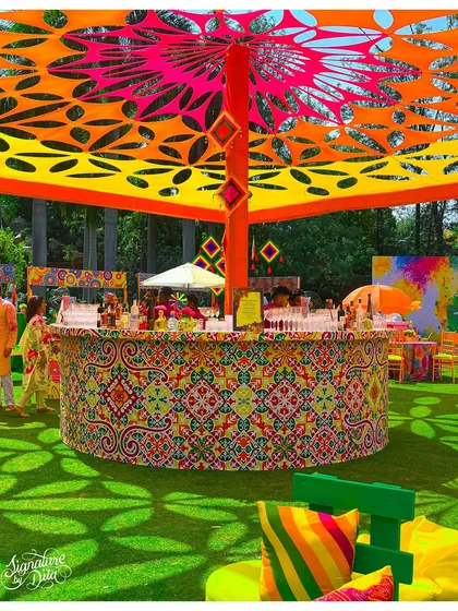 This circular bar was the centerpiece for a vibrant Holi festival. The intricate patterns, custom canopy, and explosive colors show how I can build a high-energy, branded experience for large-scale outdoor events.