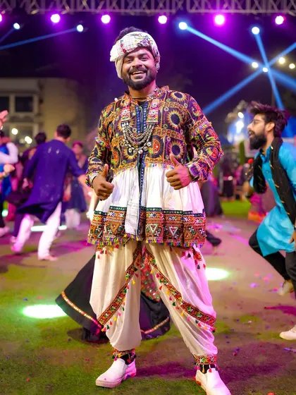 Hosting large-scale public festivals like Navratri is my passion. Here I am at Raasleela Mumbai, dressed in traditional attire, connecting with thousands of people through music, dance, and pure festive energy.
