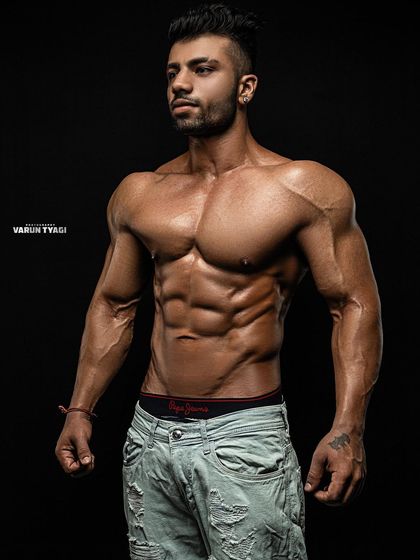 A professional photo showcasing my physique. My goal is to meet you at the top, not the crowded bottom.