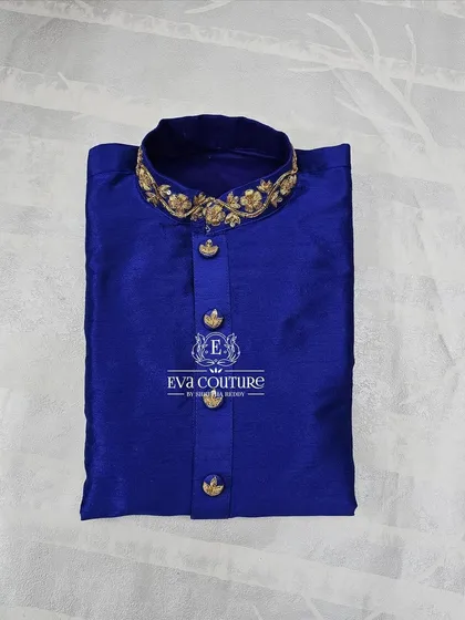 Another view of the royal blue kurta, showing the rich fabric and detailed collar.