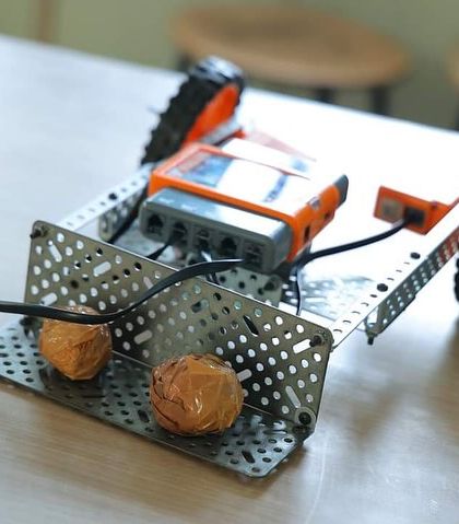 A close-up of a student-built robot from our workshop at Rawal Convent School. This project showcases the practical application of engineering and programming concepts taught in our courses.