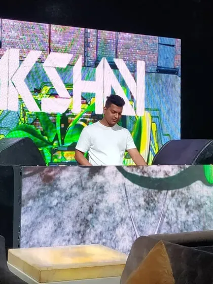 Your event gets my full brand of energy, right down to the visuals. I project my custom logo and graphics on the main screens, creating a professional and high-impact atmosphere. This setup shows how I can transform any venue into a top-tier party zone.
