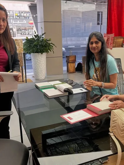 Selecting wallpapers in Dubai for the villa project. This is a key part of the material selection process, where we choose textures and patterns that will complement the overall design aesthetic.