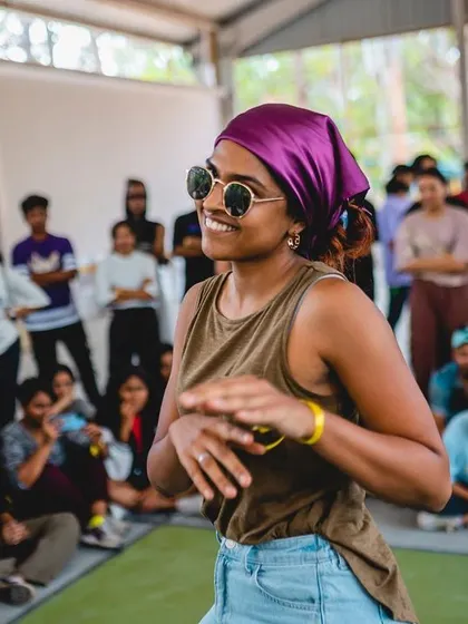 A smiling dancer enjoying the battles at Spectra 2023.