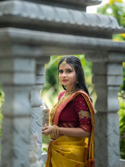 A portrait of the model, her traditional attire and elegant pose creating a look of timeless beauty.