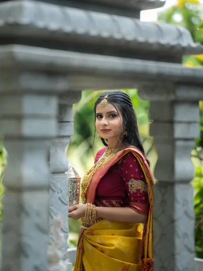 A portrait of the model, her traditional attire and elegant pose creating a look of timeless beauty.