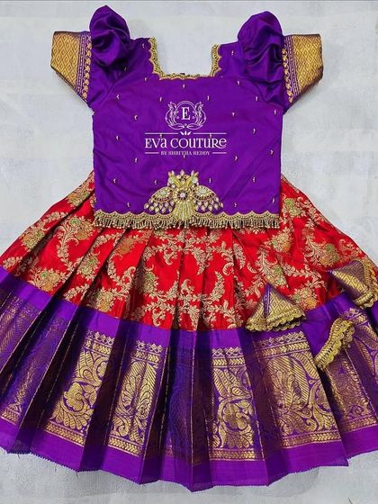 A festive combination of red and purple. This Kanchi Pattu lehenga has a rich brocade skirt and a beautifully embroidered blouse.
