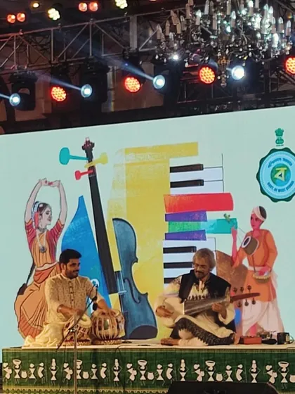 The stage setup for the 'Treasured Traditions' event was beautiful, with illustrations of West Bengal's rich cultural heritage.