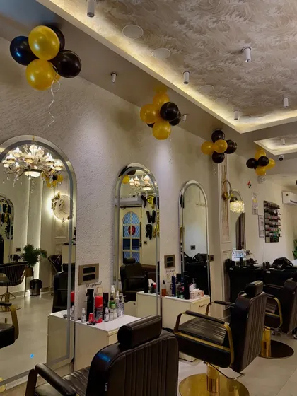 I believe the environment is a huge part of the experience. I've designed my salon to be a beautiful, luxurious space where you can relax from the moment you step inside. This is a view of my main styling area, ready to welcome you.