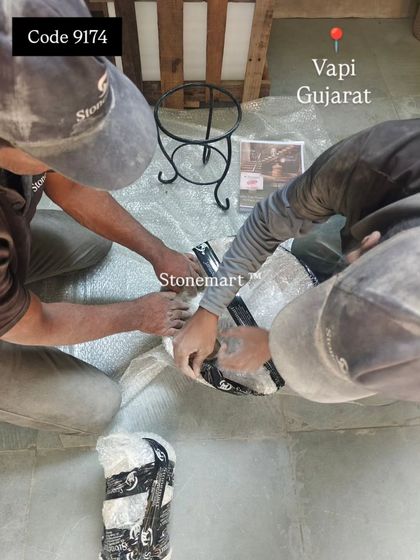 My team is shown here beginning the packing process for a beautiful stone tabletop fountain, ensuring every component is carefully wrapped.