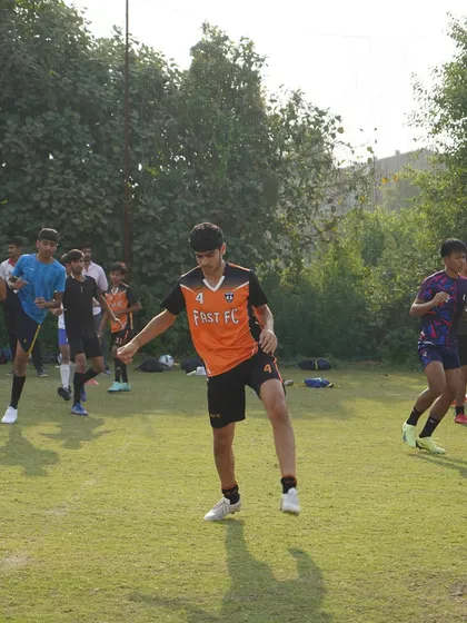 Our senior players begin their session with dynamic stretches and warm-ups.