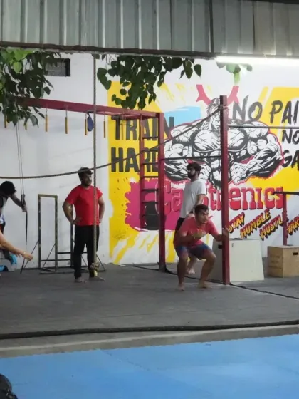 A snapshot of a typical group session in our open-air arena. Here, members are engaged in a variety of functional movements, including box jumps and agility drills, building a community while getting stronger together.
