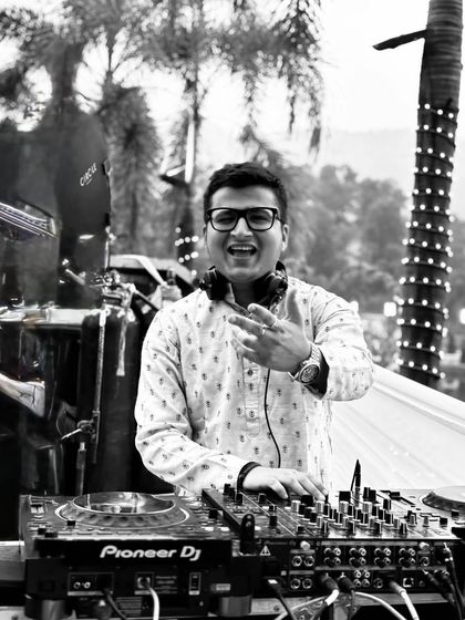 A classic black and white shot from an epic Baraat experience. It's all about the beats, the wheels, and a whole lot of love.