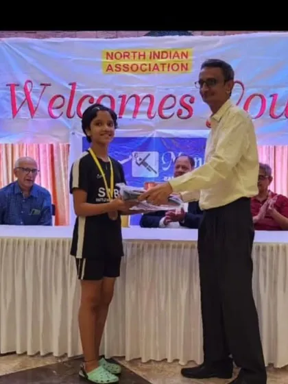 Aarohi Salunke receiving her first-place gold medal at the Monara badminton tournament. A proud moment for our advance batch player.