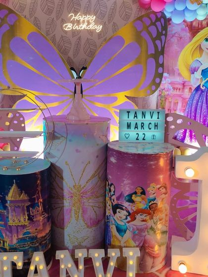 A detailed shot of the princess themed cake tables, featuring custom prints of castles and Disney princesses.