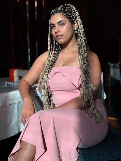 A sitting portrait showing off the long braids. This look was a whole mood, perfect for a dramatic, high-fashion aesthetic.