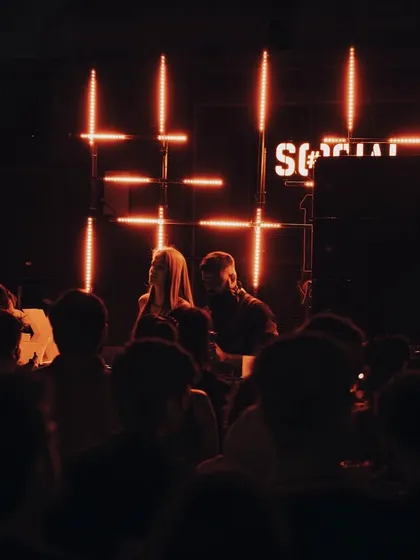 A shot from the GIGx 440Hz event, with the crowd framed by the stage and the iconic "SOCIAL" sign.