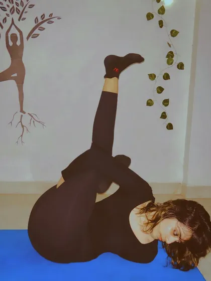 A complex twisting and binding pose that deeply opens the hips and stretches the spine. This kind of asana demonstrates how yoga works on multiple levels, improving flexibility while also detoxifying the internal organs through compression.