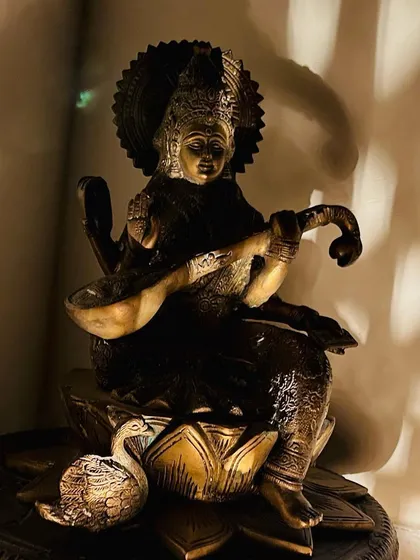 The divine presence of Goddess Saraswati guides us in our music room. She is the source of all knowledge and art, and her blessings are essential for any musician's journey.