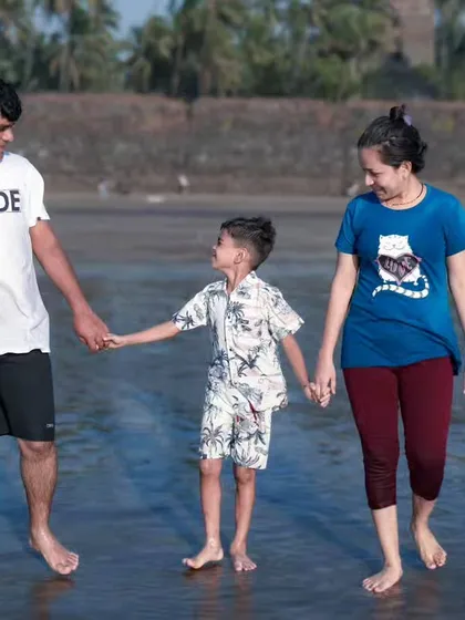 A candid moment of a family walking together on the beach. I love capturing these simple interactions that show the natural bond between parents and their child.