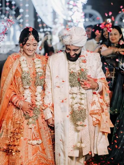 The grand exit through a shower of petals. This is a moment of pure celebration, and I make sure to capture the joy on your faces as you walk through your cheering friends and family.