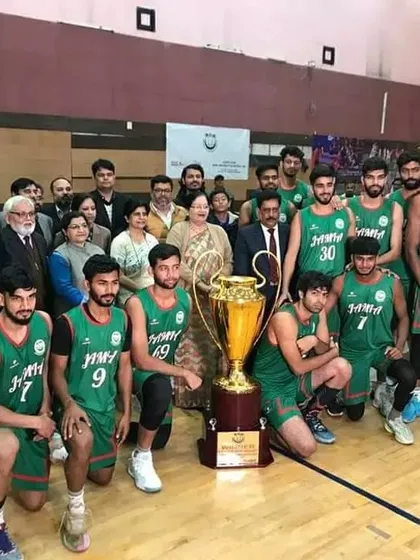 A full group photo of the winning basketball team, officials, and guests after the North Zone final. This picture represents the successful culmination of a massive organizational effort involving 64 universities.