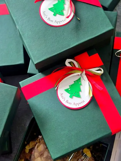 My Christmas cakes are packaged in these beautiful green and red gift boxes, making them a perfect holiday present for loved ones.