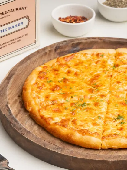 The 3 Cheese Pizza, showcasing its golden, bubbly surface that promises a delightfully cheesy pull with every slice.