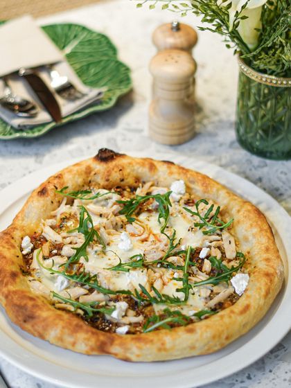 Our basil pesto pizza gets an upgrade with tender pieces of chicken and fresh rocket leaves. The combination of our farm-fresh pesto and savory chicken is a winning one.