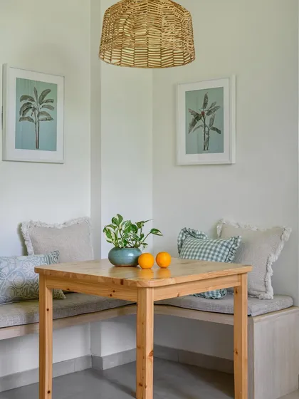 At one end of the 'House of Kismish' kitchen, we tucked in this cozy little breakfast nook with built-in bench seating, perfect for morning coffee.