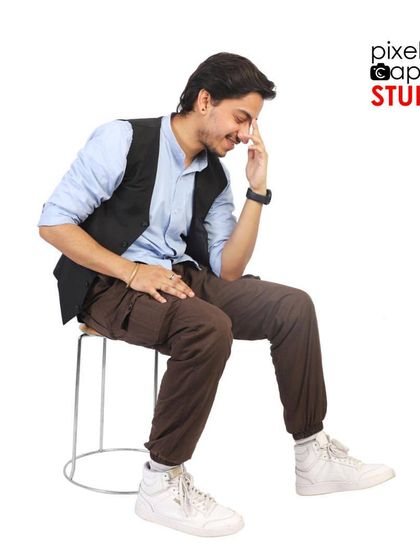 A candid, seated pose that adds personality and range to a model's portfolio.