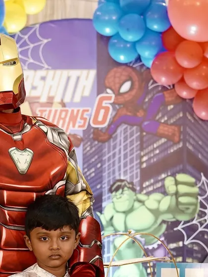 Make your child's party unforgettable with a visit from their favorite superhero. I arrange for professional character artists, like Iron Man here, to interact with the kids, pose for photos, and bring the theme to life.