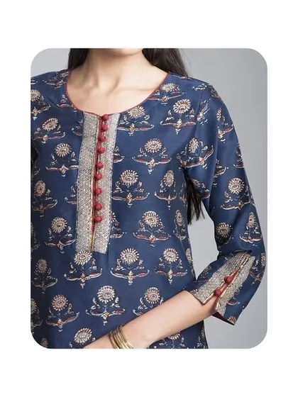 A close-up of a round neckline with a contrasting silver and red placket, finished with small potli buttons. I can add similar custom plackets to any kurti to match your dupatta or bottoms.