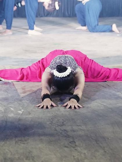A full front split, Samakonasana, during our third annual event. This pose represents dedication and the fruits of consistent practice.