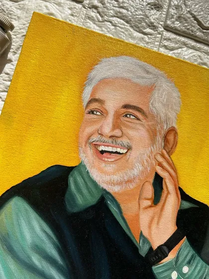 A close-up of the oil portrait, highlighting the texture of the paint and the detailed work on the man's smiling face and white hair.