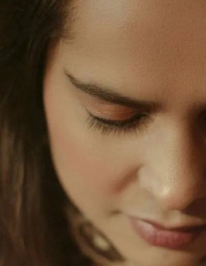 An extreme close-up focusing on the bride-to-be's serene expression. These detailed shots capture subtle emotions and add a deeply personal touch to your photo album.