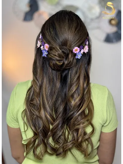 The final look, a whimsical and romantic hairstyle using pressed flowers.