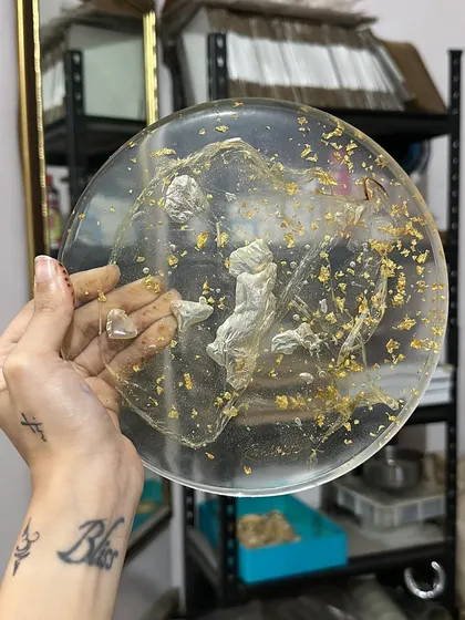 A clear plate with gold flakes and 3D cherub figures. This was one of my favorite experimental pieces from last year.