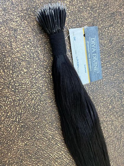 A bundle of black Nano-Tip extensions from our Diya Divine premium line, known for its exceptional quality.