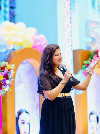 A classic black dress for a corporate event. Professional, poised, and ready to command the stage.