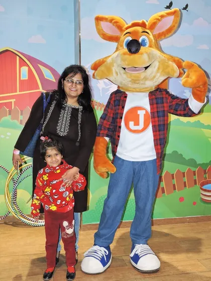 A mother and daughter with J the Fox during our special Mother's Day celebration.