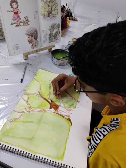 A teen student learns to draw and paint a complex tree structure, focusing on the fundamentals of form and color.
