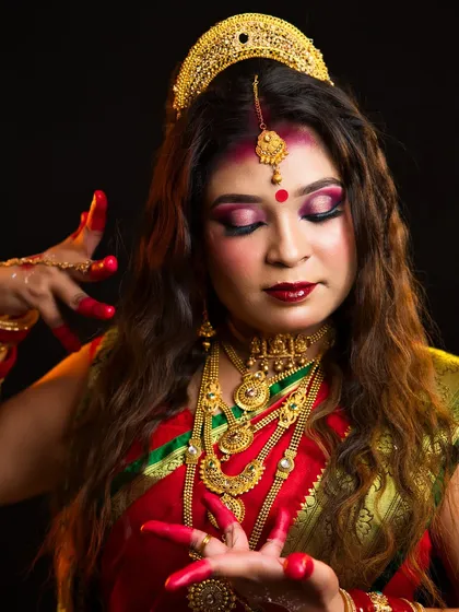A close-up of the Maa Siddhidatri makeup, focusing on the intricate eye makeup and traditional jewelry.