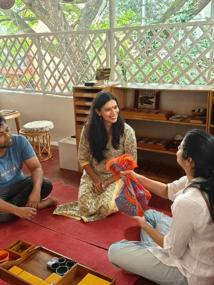 The joy of shared discovery and connection between parents in our workshop space. These moments of conversation and laughter are just as important as the hands on work, building a true community of support.