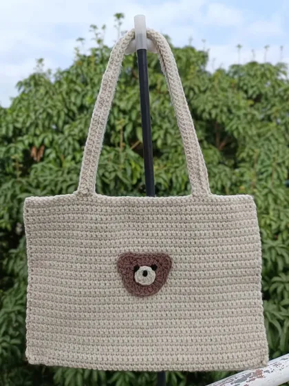 Another view of the bear tote bag, showing its clean lines and sturdy handles. It's a practical and adorable accessory.