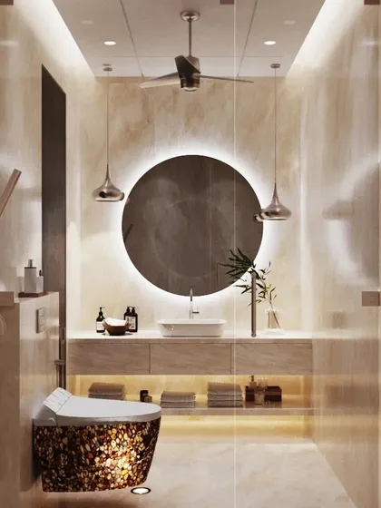 This bathroom design exudes warmth and tranquility. The space is clad in soft, beige-toned onyx, with a large, round backlit mirror creating a focal point above the floating vanity. The result is a serene, spa-like environment.