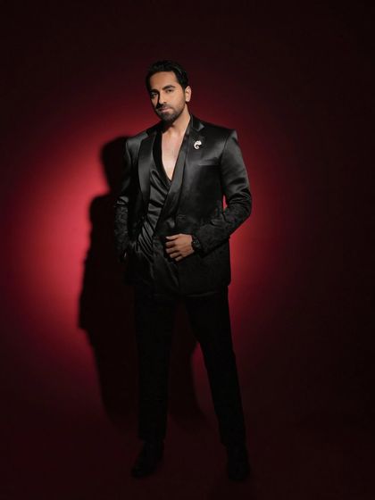 A confident, hands-in-pockets pose from the Pinkvilla feature, conveying a relaxed yet stylish attitude.