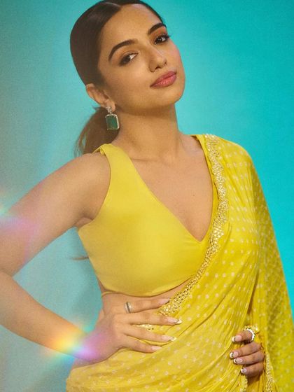 The final look! Ahsaas Channa looking radiant in a yellow sari, with her custom white and gold nails adding the perfect touch of elegance.