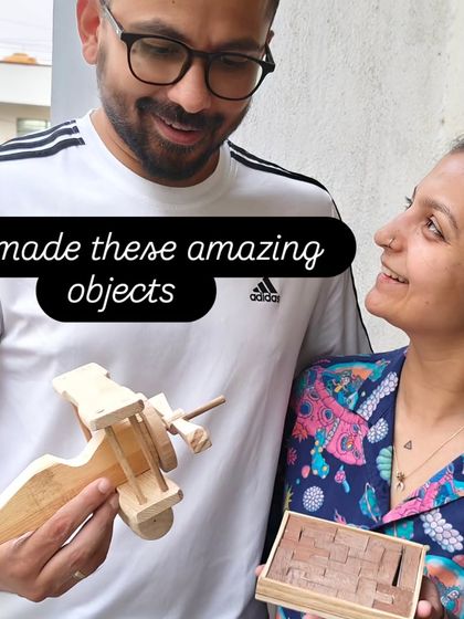 A couple enjoying the results of their creative efforts. He made a wooden airplane, and she created a block puzzle, both fantastic handmade gifts.